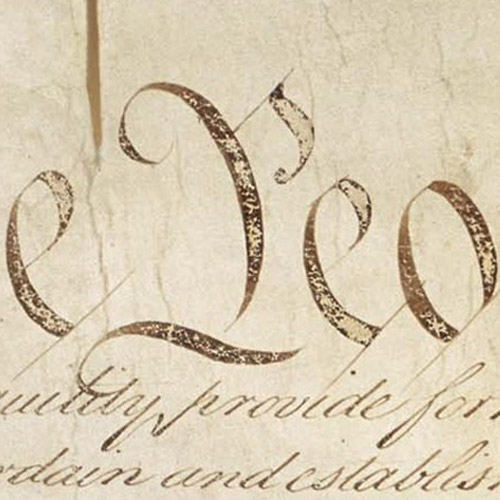 flag with eagle and capitol building